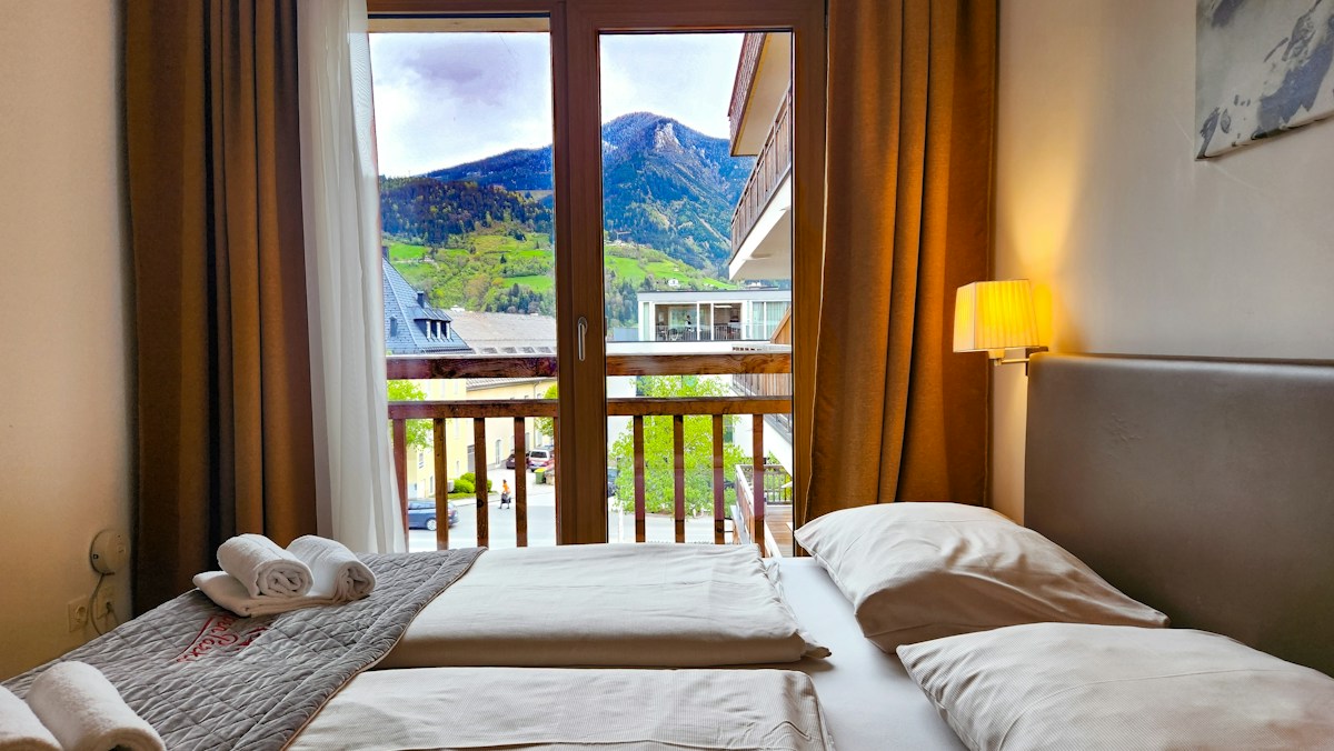 Premium twin-bed room in a 3-star hotel with a mountain view
